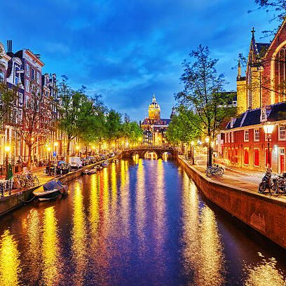 Westerkerk (Western Church), with water canal view in Amsterdam. Netherlands.